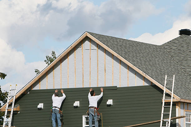 Professional Storm Damage Siding Repair technician working in Springdale, NC
